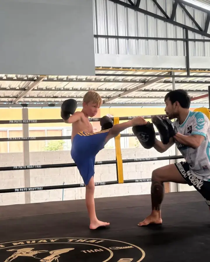 Kru Kong with a young student after kids class at PM PAYU, Koh Samui