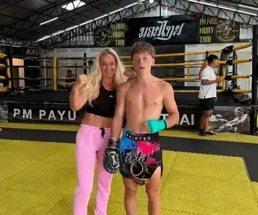 Mother and son posing after training at PM PAYU Muaythai, Koh Samui