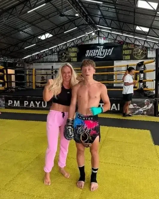 Mother and son posing after training at PM PAYU Muaythai, Koh Samui