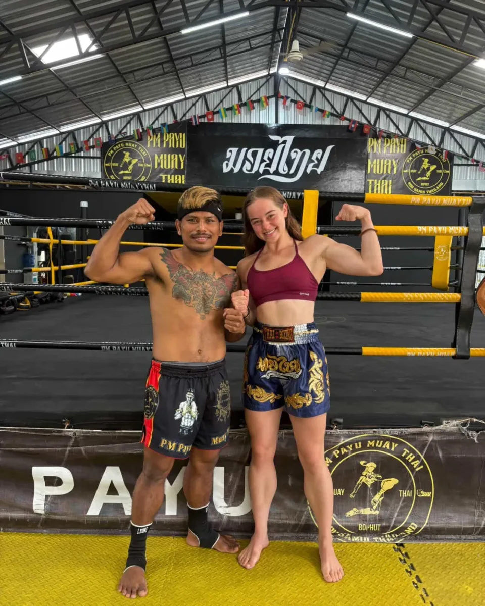 Kru Koban and Clover flexing in the ring at PM PAYU Muaythai, Koh Samui